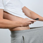 Man taking a picture of his penis with a smart-phone